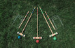 © Cavan Images - High angle shot of wooden croquet set on the grass.