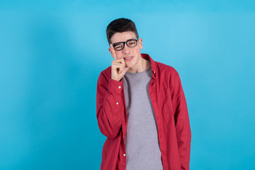 trendy teen boy or student in urban fashion isolated on color background