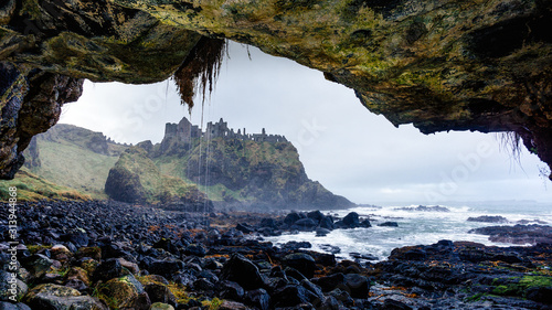 Ruined medieval Dunluce Castle on the cliff Poster Mural XXL
