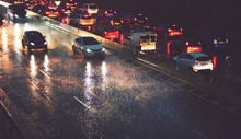 Car Traffic By City Highway In Rainy Night