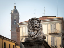 Statue Of One Of The Two Lions Placed On The Pylons Of The "Ponte Dei Leoni", In The City Center Of Monza (Italy)