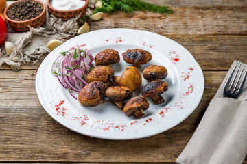 Wall Mural - Skewers of mushrooms on wooden table