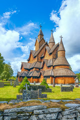 Wall Mural - Heddal Stave Church on a cloudy summer day.Notodden municipality.Vestfold og Telemark county.Norway