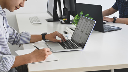 Cropped shot of young programmer team while they are working/giving a concentrate on work in the office.