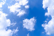 © NaPUN - The blue summer sky with white fluffy clouds. Photo from window on the airplane.