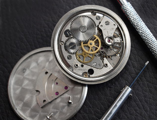 close up of  old mechanical watch mechanism under repair