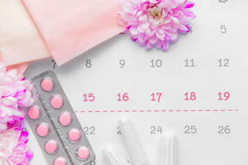 Sticker - Menstrual calendar with feminine products and pills, top view