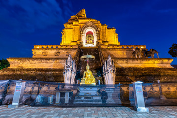 Wat Chedi Luang is a Buddhist temple in the historic centre and is a Buddhist temple is a major tourist attraction in Chiang Mai,Thailand.at twilight time blue sky clouds sunset background.