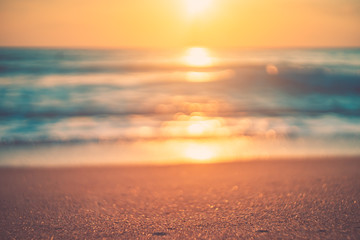 Wall Mural - copy space of soft sand sea and blur tropical beach with sunset sky and cloud abstract background.
