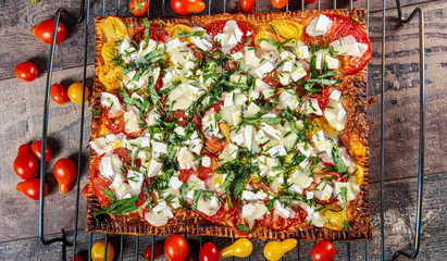 vegetarian homemade pizza with tomatoes and cheese