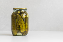 Fermented Vegetables. Glass Jar With Homemade Pickled Ugly Cucumbers On A White Background. Copy Space, Close-up