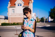 © Вероника Преображенс - girl in a blue plaid shirt travels. Woman with a smartphone for a walk