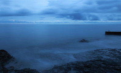 Blue. Hour. Water. Cloudy. Sky. Sea. Side