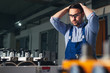 © zorandim75 - Industrial worker being worried for bad results in production.