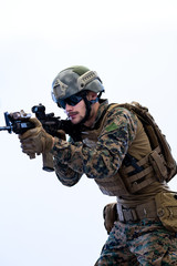 soldier in action aiming laseer sight optics