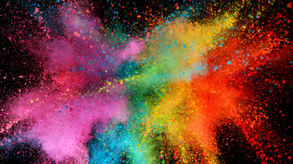 Wall Mural - Explosion of colored powder isolated on black background