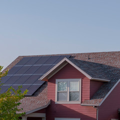 Poster - Square Array of photovoltaic solar panels on a roof