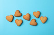© Atlas - Heart shaped cookies on blue background, space for text