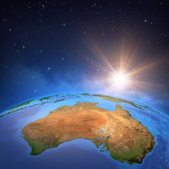 Wall Mural - sun shining over australia from space