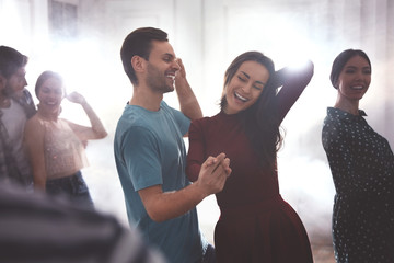 Poster - Lovely young couple dancing together at party