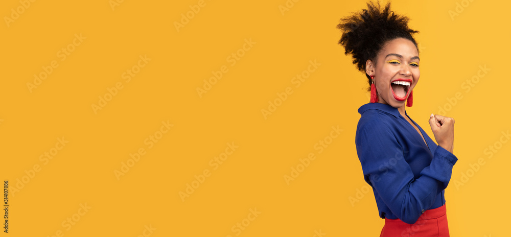 Happy afro woman triumphing with raised hands - obrazy, fototapety, plakaty 