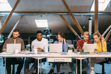 Team of programmers working in software developing company