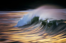Photo Of A Wave Breaking At Sunset With In Camera Panning Technique