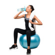 © Prostock-studio - African American Girl Drinking Water Sitting On Fitball, White Background