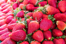 Big Pile Of Fresh Juicy Red Strawberries On Fruit Market