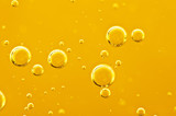 Fototapeta Łazienka -  Oil background. Golden liquid with air bubbles on white background  for projects, oil, honey, beer, juice, shampoos.