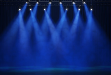 Stage light with colored spotlights and smoke.