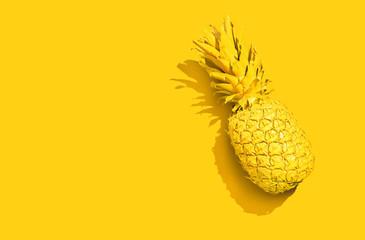 Yellow pineapple on a yellow background