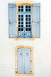 Picturesque windows with shutters in historic center of Avignon, Provence