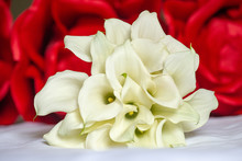 White Calla Lilies Bouquet With Red Roses Background