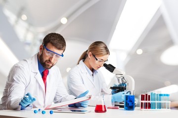 Wall Mural - Man researcher carrying out scientific research lab