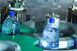 © Ludmila - Filling line of sparkling water in pet bottle. Mini factory for
