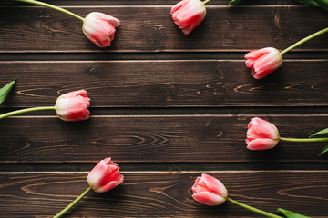 Wall Mural - pink flowers tulips on wooden table for greeting card template