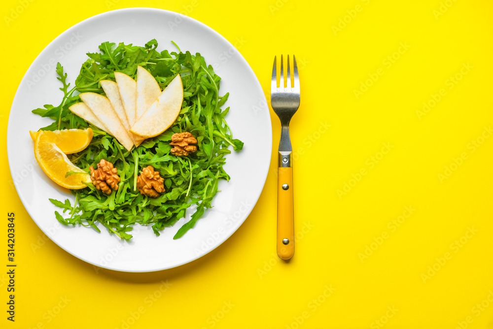 Plate with tasty salad on color background