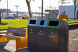 Landfill, recycle, compost combined waste trash bins in public park