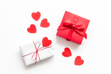 Present To A Lover On Valentine's Day. Gift Boxes Near Paper Hearts On White Background Top-down