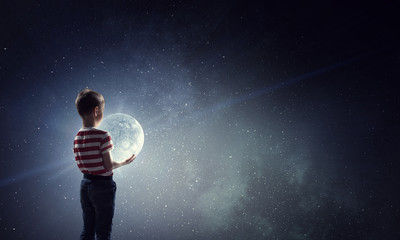 boy holds the moon . mixed media