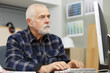 © auremar - senior man using a computer