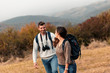 © Zoran Zeremski - Young couple enjoying hiking together in nature.