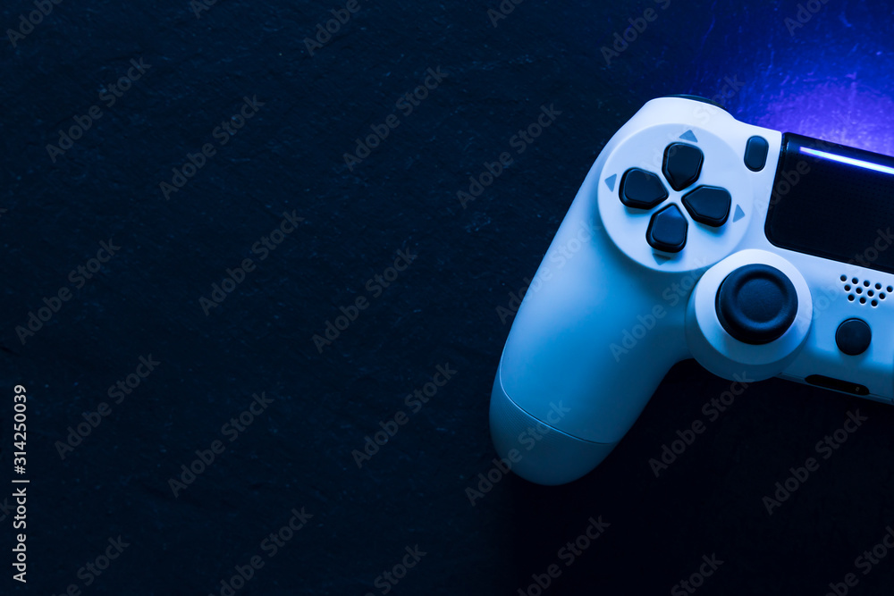 Video game gaming controller night with lights dark background top view - obrazy, fototapety, plakaty 