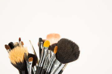 Makeup brushes on white background