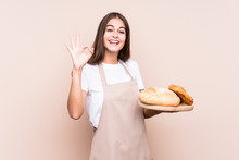 Young Caucasian Baker Woman Isolated Cheerful And Confident Showing Ok Gesture.