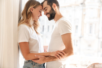 smiling young couple embracing
