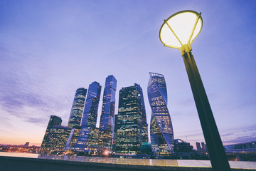 Skyscrapers of Moscow City business center and Moscow river in Moscow at night, Russia. Architecture and landmark of Moscow.