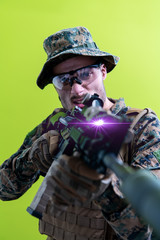 Wall Mural - soldier in action aiming laseer sight optics green background