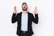 © Asier - Young caucasian business man against a white background isolated screaming to the sky, looking up, frustrated.